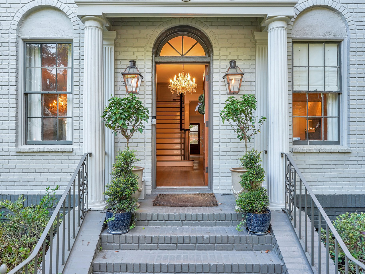 Classic Ardsley Park mansion exterior with ornate details and lush gardens nearby.