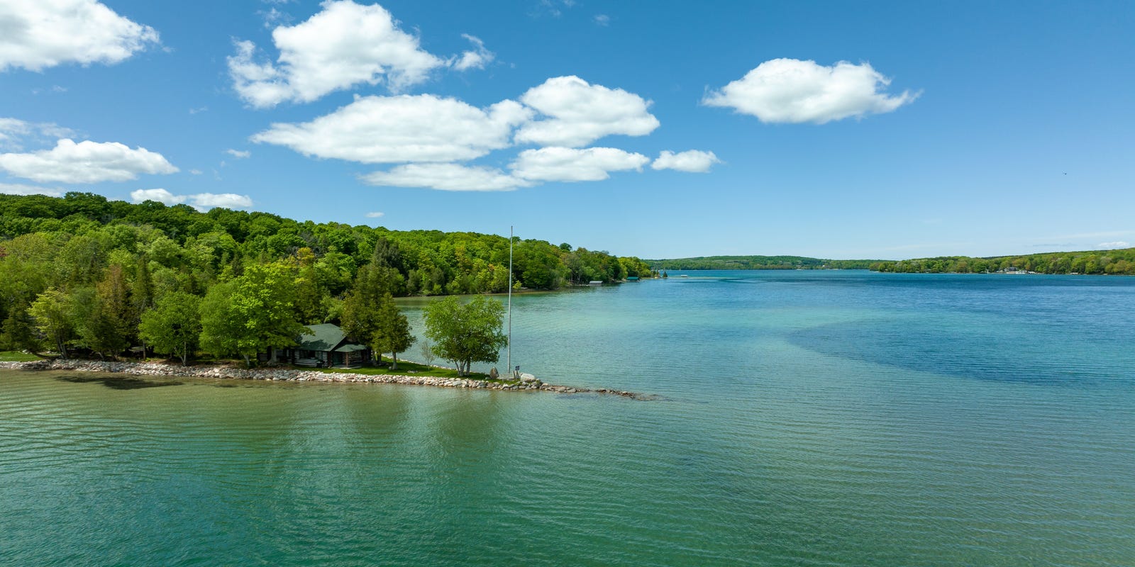 Log home estate on Walloon Lake lists for $18M, Hemingway connection highlighted.